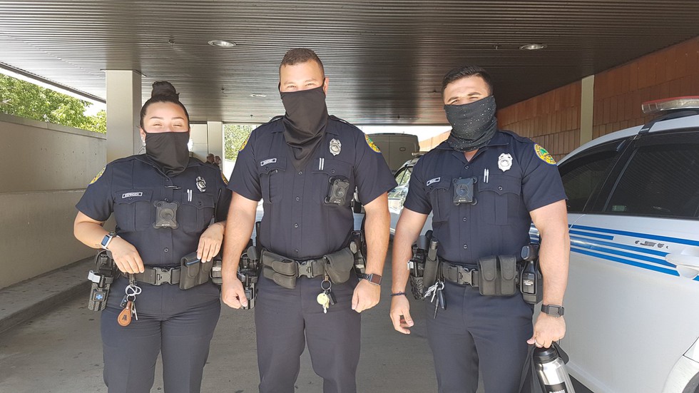 Miami Police officers posing with masks Facebook.jpg