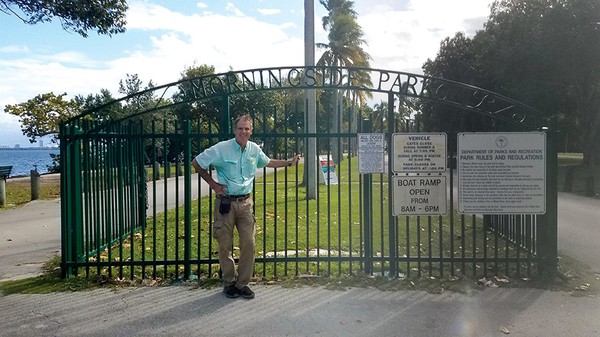 Elvis Cruz in front of park entrance gate (1).jpg