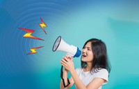 unlimphotos_com_29863046_young-woman-standing-smile-holding-and-shouting-into-megaphone.jpg