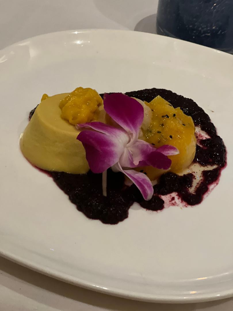 A vegan option mango pudding dessert, layered with passion fruit, mango, guava and finished off with a blueberry chutney _.jpg